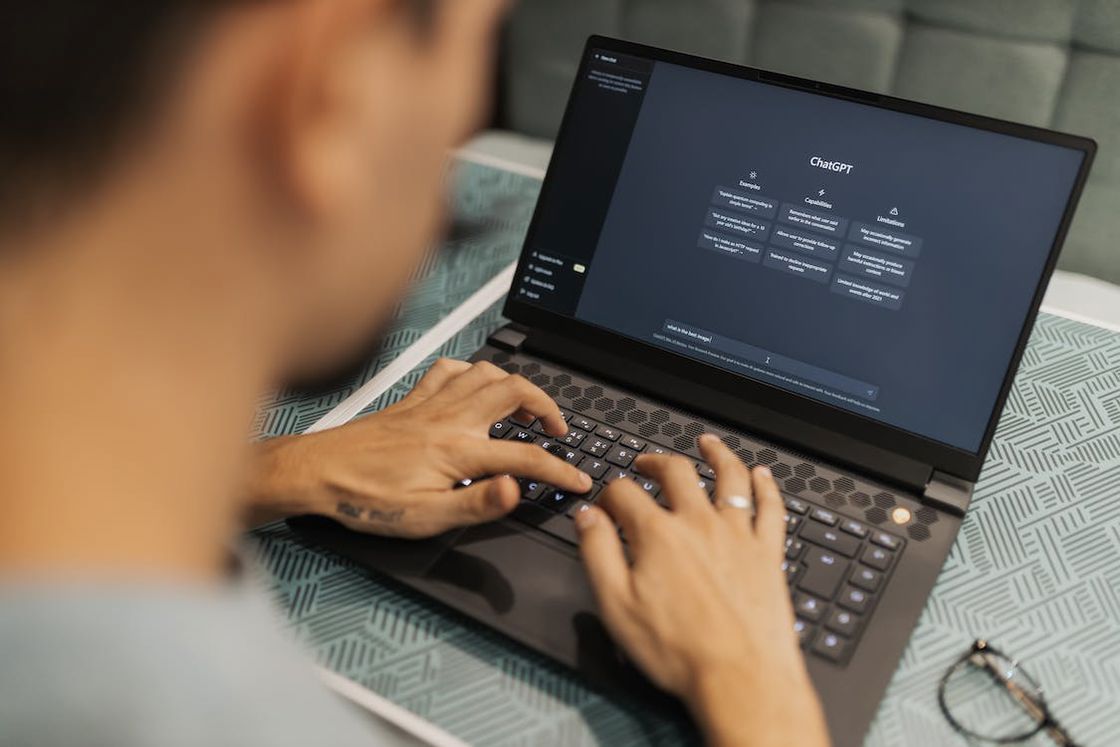 Man using the ChatGPT app on his laptop