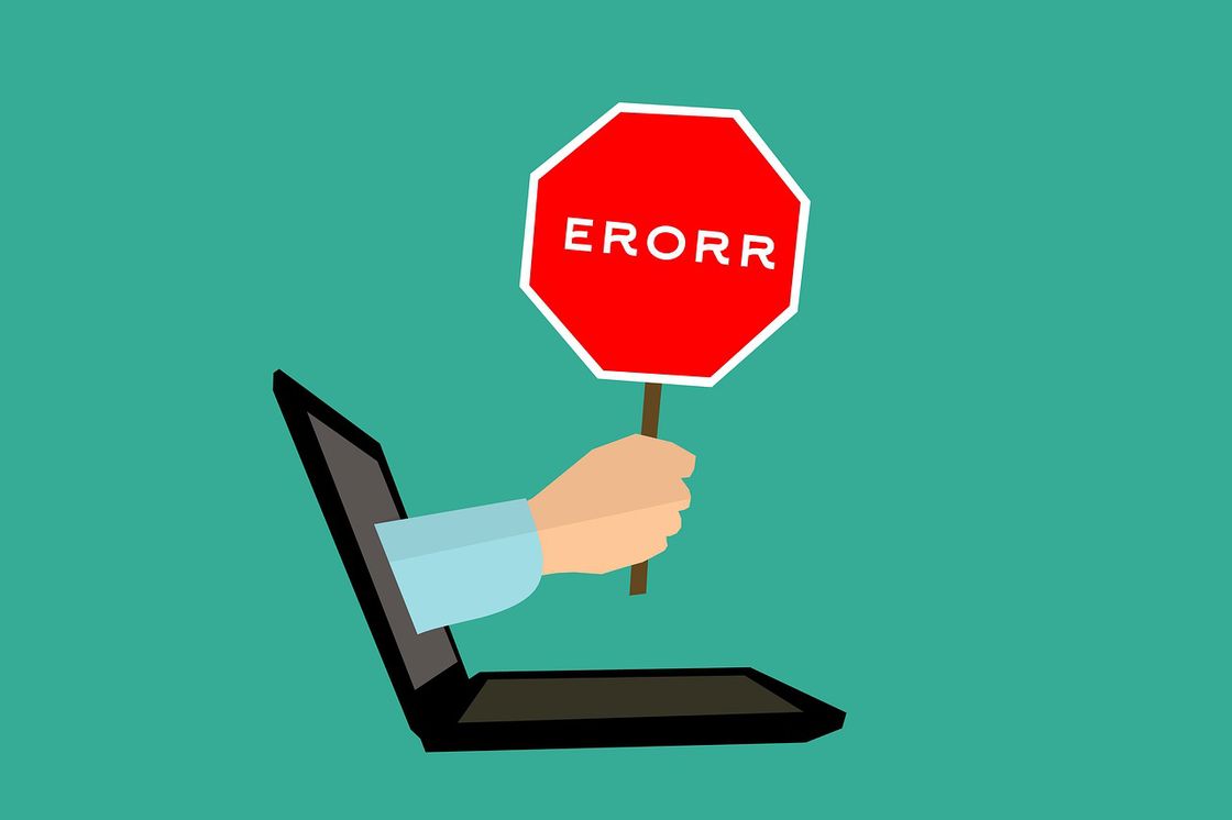 Graphic illustration of a hand coming out of a laptop holding an error sign