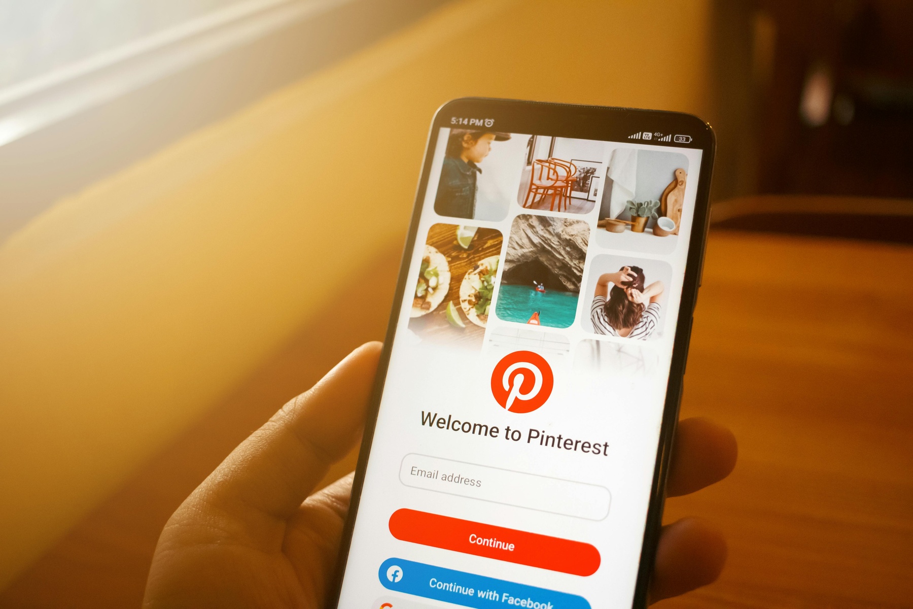 Person opening the Pinterest app on their phone